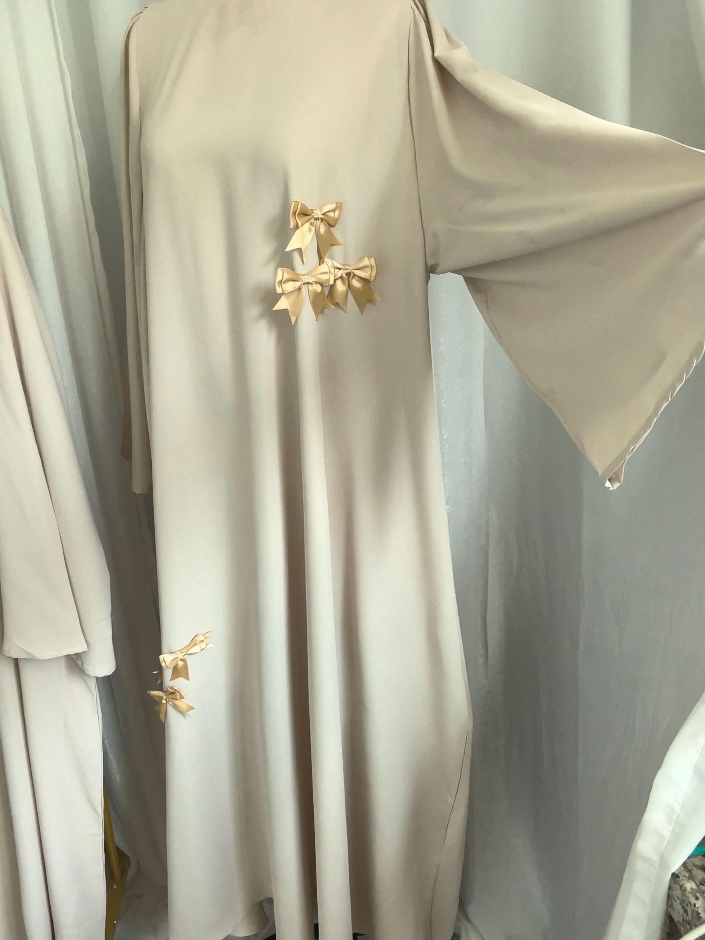 elegant white abaya with floral embroidery