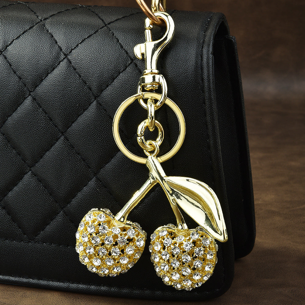 Gold cherry shaped keychain with rhinestone embellishments - luxury keychain bag charm