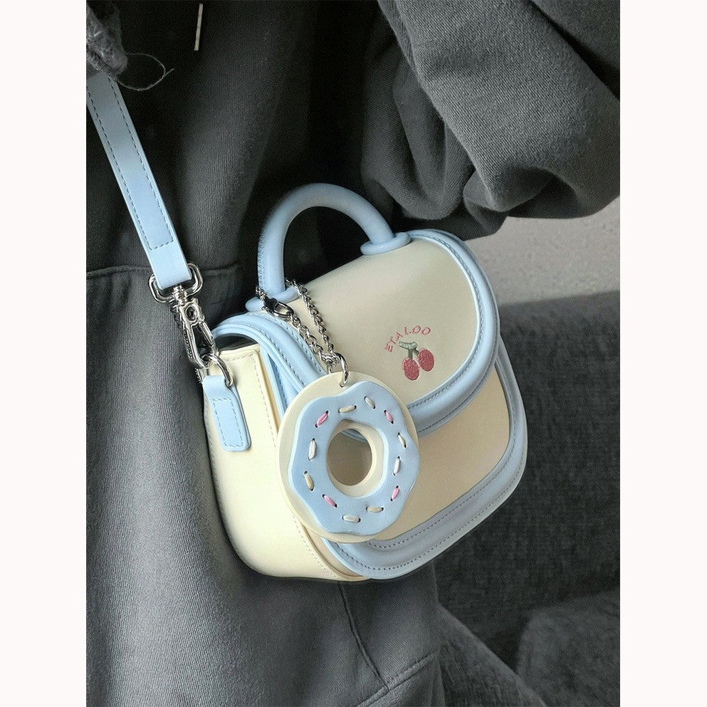 Hand-held shoulder saddle bag