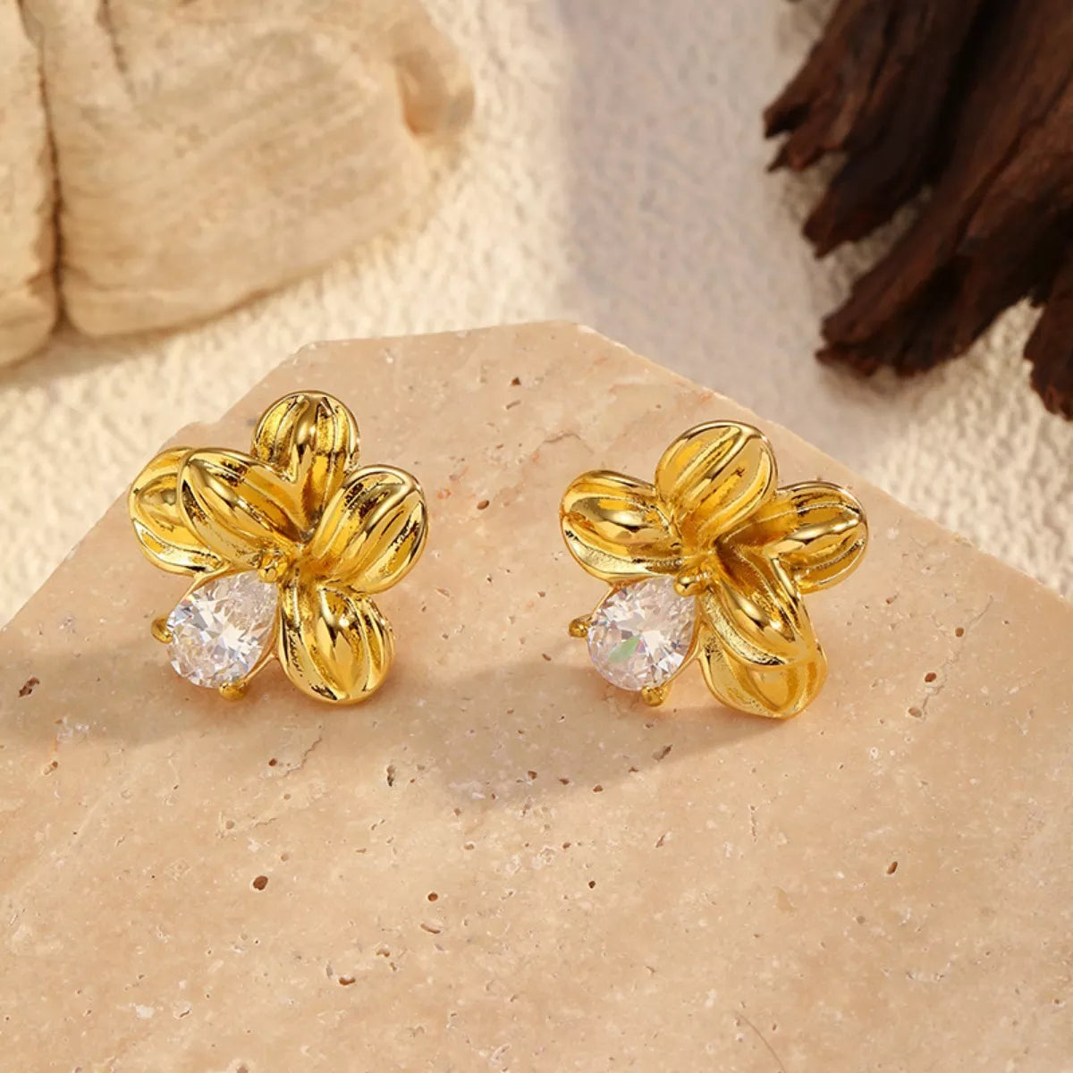 "18K gold-plated flower stud earrings with delicate petal design"