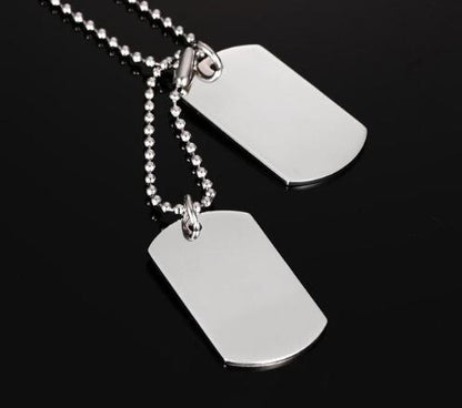 Dog Tag Pendant Necklace featuring a polished stainless steel design with a ball chain.