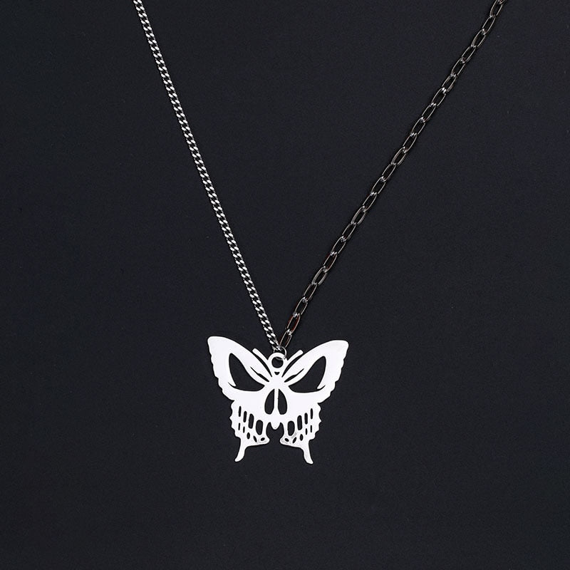 Gothic silver butterfly pendant necklace with detailed wing design on black background"