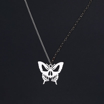 Gothic silver butterfly pendant necklace with detailed wing design on black background"