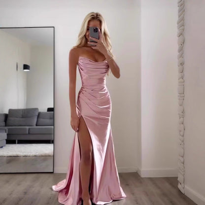 Women wearing pink cowl neck satin dress midi length