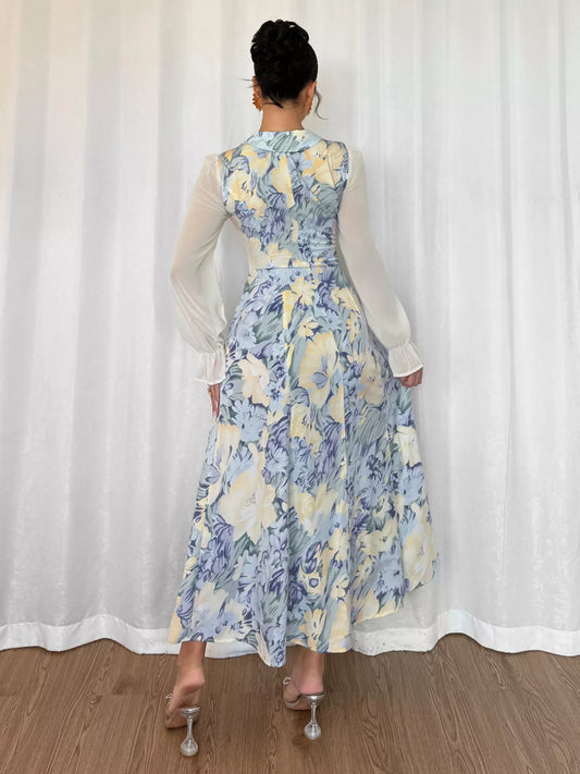 Back view of a Printed Flounce Sleeves Dress highlighting its elegant design and flowing silhouette.