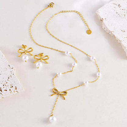 Pearl jewelry set in bowknot design with gold bow accent
