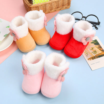 Fleece cotton sock shoes for Toddlers in pink, orange, red, and white with flower detail on a blue background.