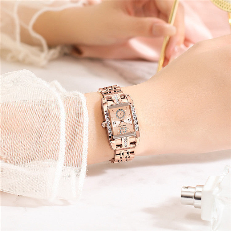 Close-up of women's square watch with stainless steel band and minimalist dial design